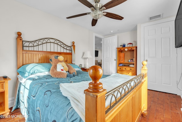 bedroom featuring hardwood / wood-style flooring and ceiling fan