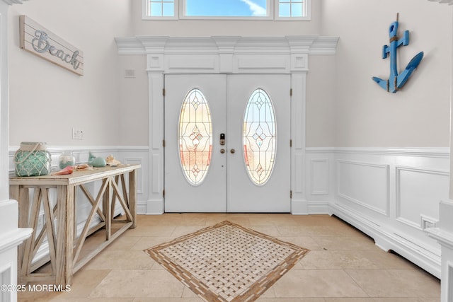 foyer entrance featuring french doors