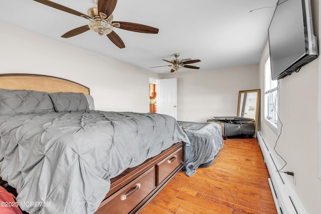 bedroom with light hardwood / wood-style floors and ceiling fan