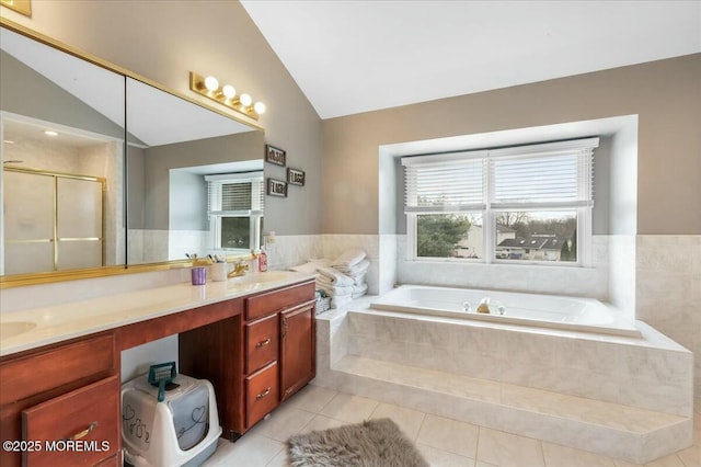 bathroom with tile patterned floors, lofted ceiling, plus walk in shower, and vanity