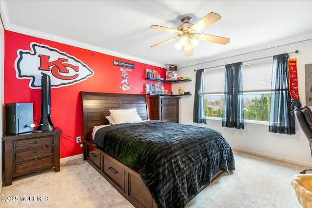 bedroom featuring ornamental molding, light colored carpet, and ceiling fan