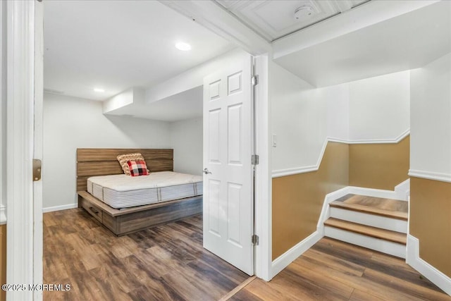 bedroom with hardwood / wood-style flooring