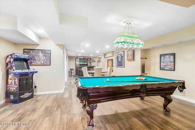 game room with billiards and light hardwood / wood-style floors