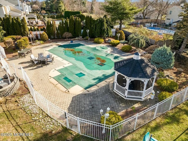 view of swimming pool with a gazebo and a patio area