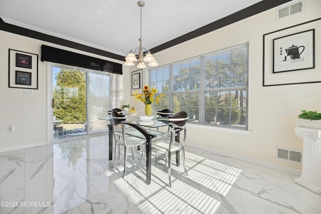 dining room featuring crown molding, a chandelier, and a wealth of natural light