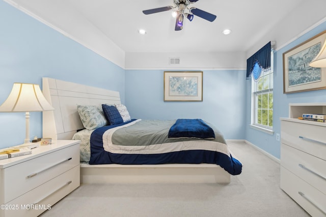 bedroom with light carpet and ceiling fan