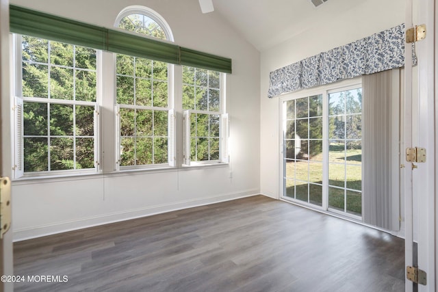 interior space featuring dark hardwood / wood-style flooring and vaulted ceiling