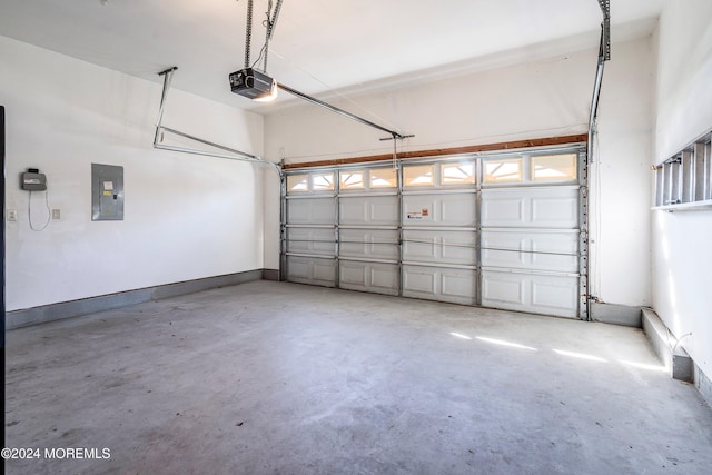 garage featuring a garage door opener and electric panel