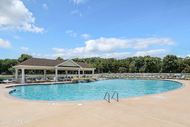 view of swimming pool with a patio area