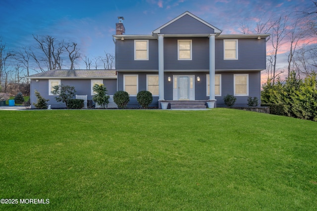 view of front of property with a lawn