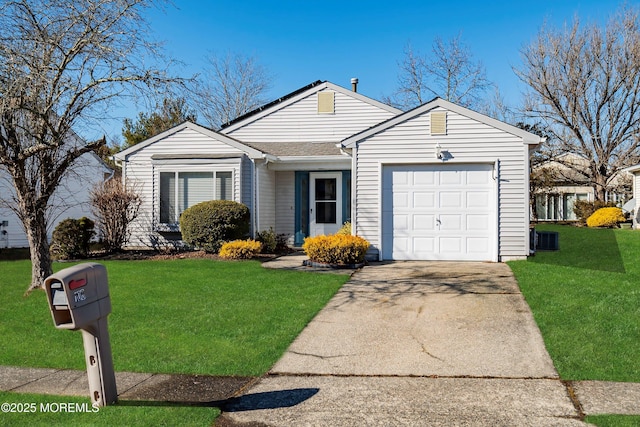 ranch-style house with a garage and a front yard