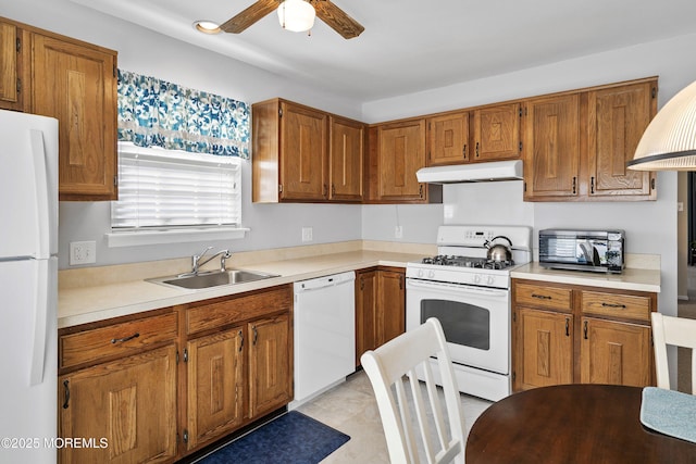 kitchen with sink, white appliances, and ceiling fan