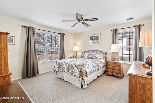 bedroom featuring light colored carpet and ceiling fan