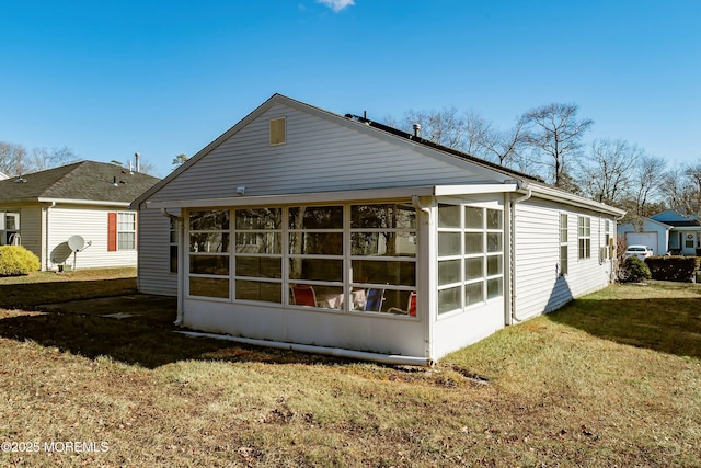 view of side of property featuring a yard