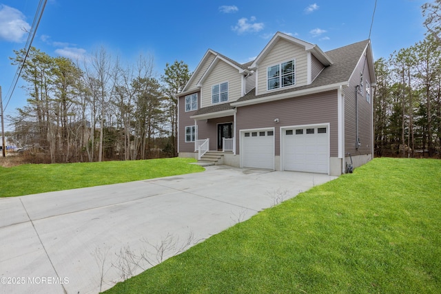 view of front of house featuring a garage and a front yard