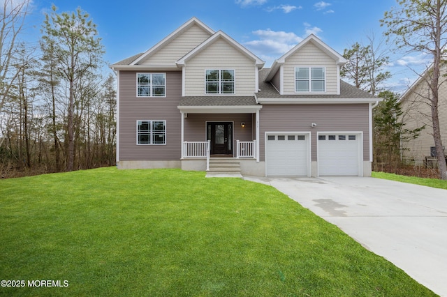 view of front of property with a garage, a front yard, and a porch