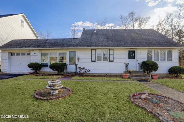 single story home with a garage and a front yard