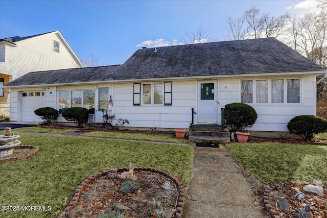 ranch-style house with a garage and a front yard