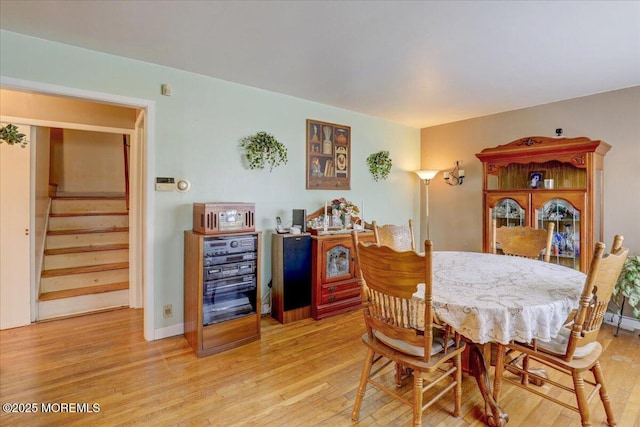 dining room with light hardwood / wood-style flooring