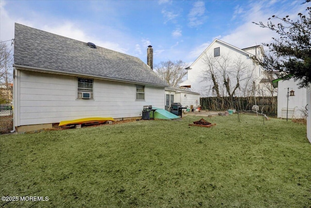 back of property featuring a yard and cooling unit