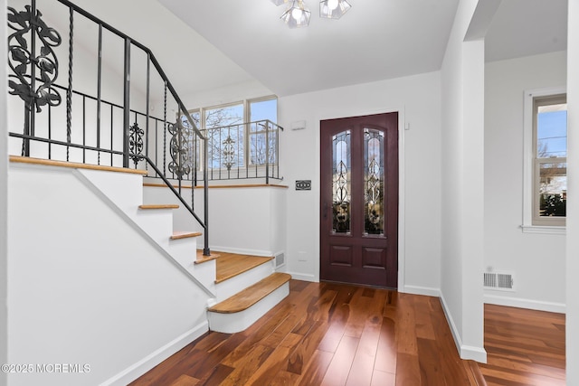 entryway with hardwood / wood-style flooring