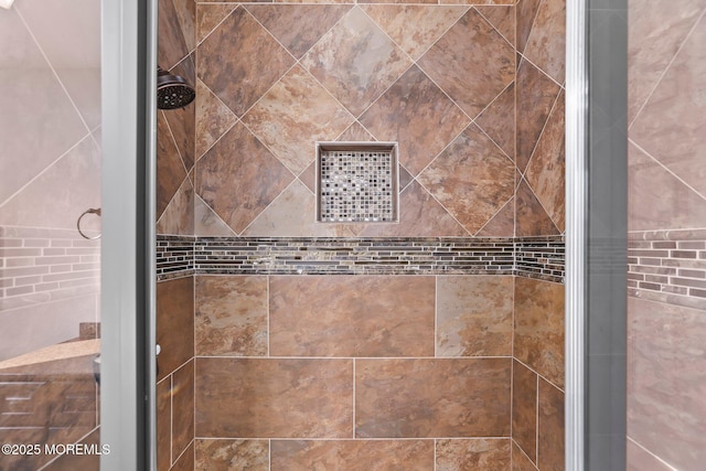 interior details with a shower with door