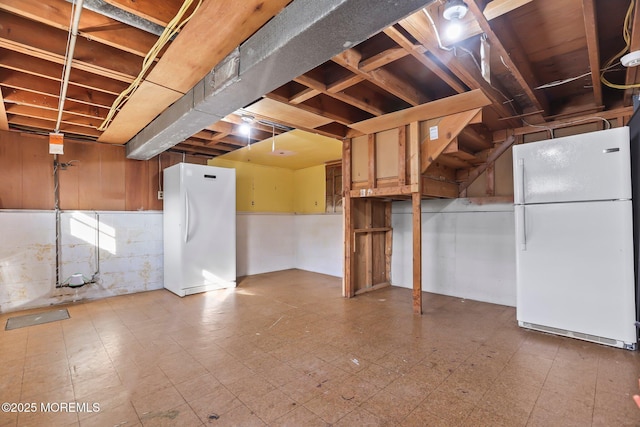 basement with white fridge