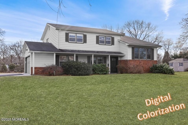 view of front of house with a garage and a front lawn