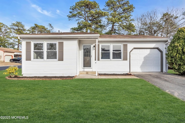 view of front of property with a garage and a front yard