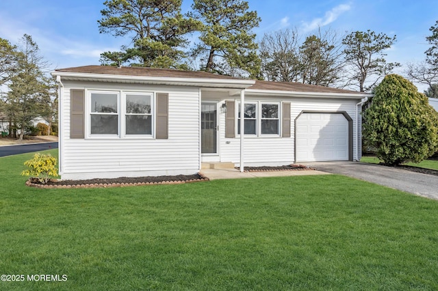 ranch-style home featuring a garage and a front yard