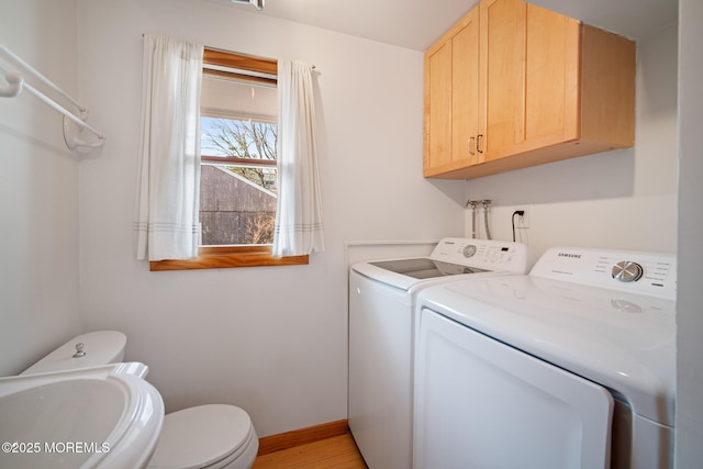 laundry room featuring sink and washer and clothes dryer