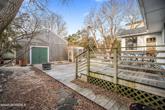 wooden terrace featuring an outdoor structure