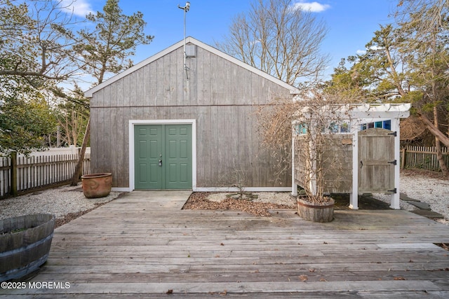 wooden deck featuring an outdoor structure