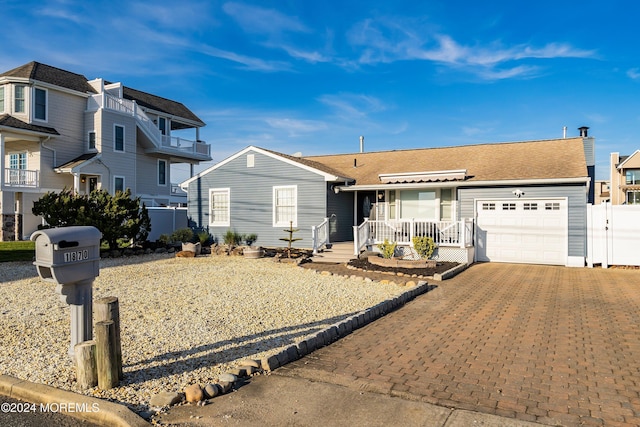 single story home with a garage and a porch