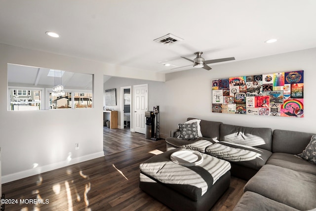 living room with dark wood-type flooring and ceiling fan