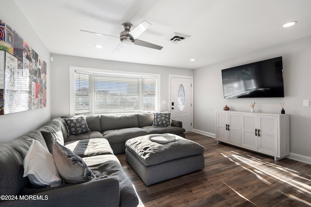 living room with dark wood-type flooring and ceiling fan