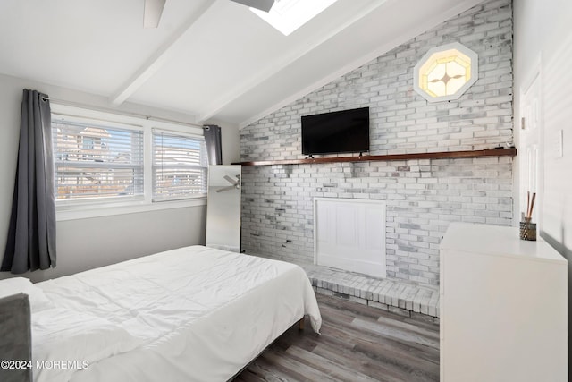 bedroom featuring hardwood / wood-style floors and lofted ceiling with beams