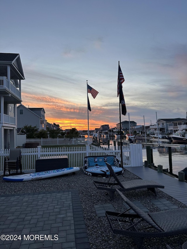 patio terrace at dusk with a water view