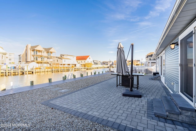 view of patio featuring a water view