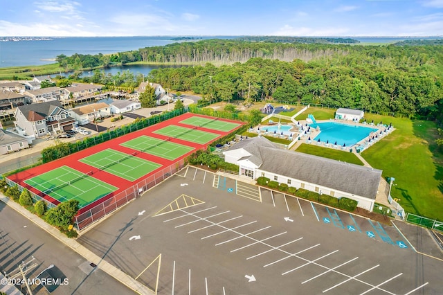 birds eye view of property with a water view