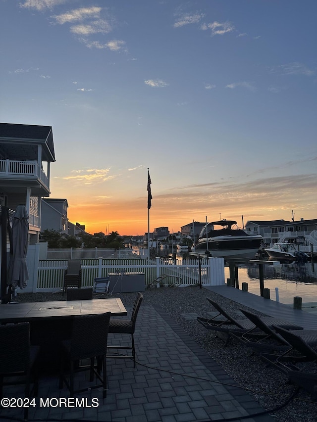 patio terrace at dusk with a water view