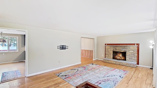 living room with hardwood / wood-style floors and a fireplace