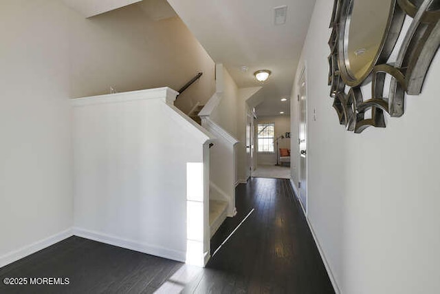 corridor featuring dark wood-type flooring