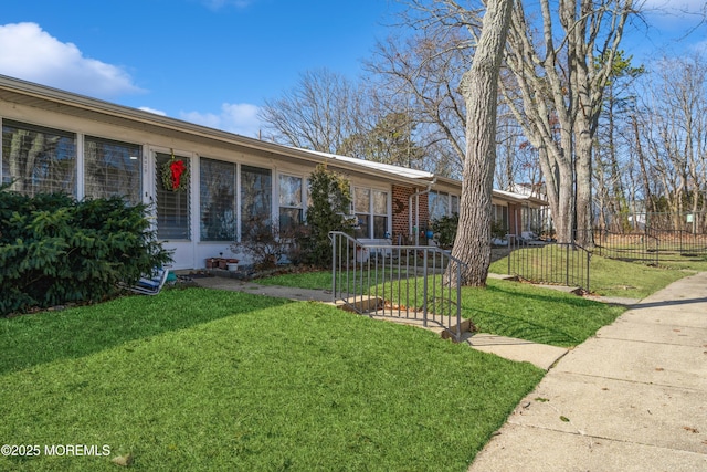 ranch-style house with a front yard