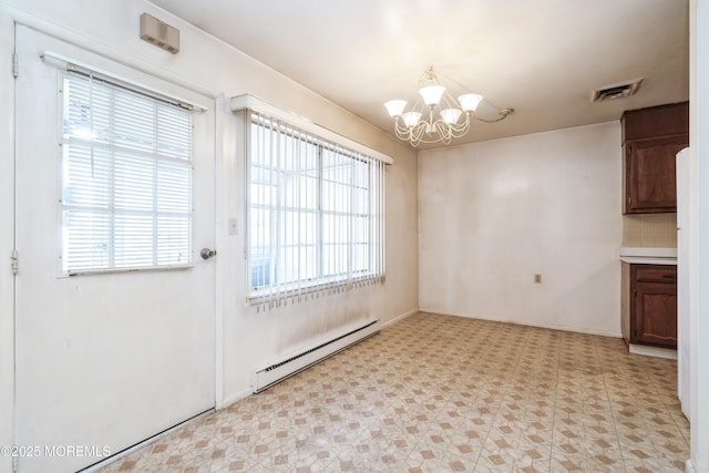 unfurnished dining area featuring a baseboard heating unit and a chandelier