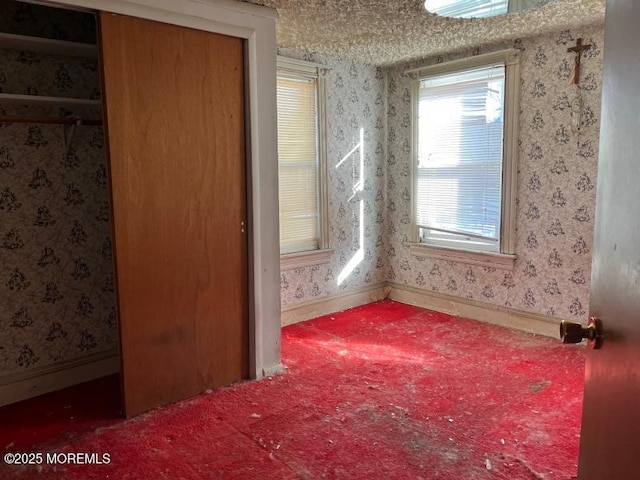 unfurnished room featuring carpet floors