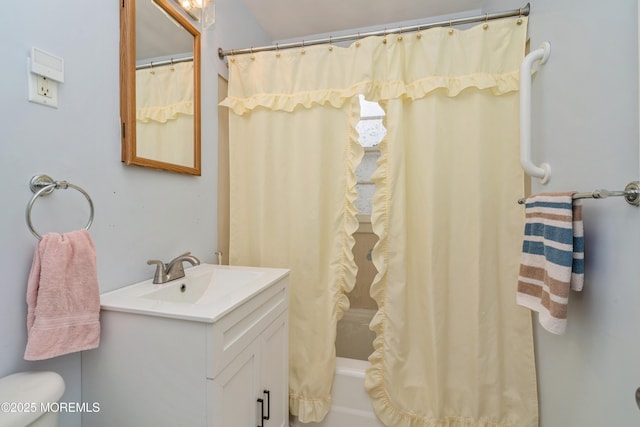 bathroom featuring vanity and shower / bathtub combination with curtain