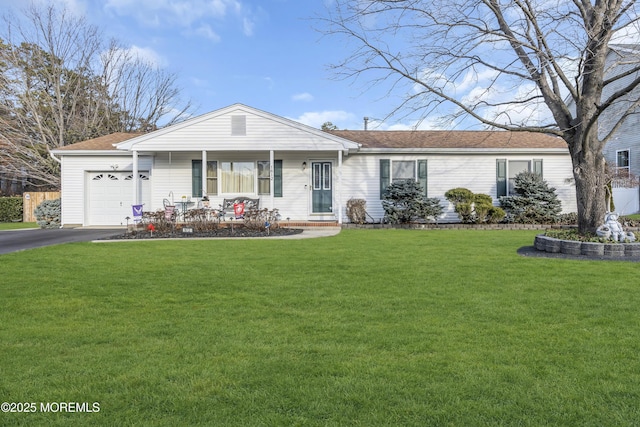 single story home featuring a porch, a garage, and a front lawn