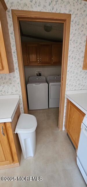 bathroom with separate washer and dryer