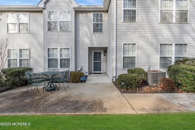 view of front of house featuring a patio and central air condition unit